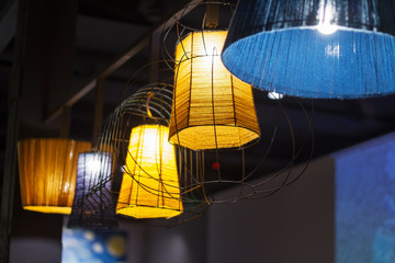 Edison's light bulb and lamp in modern style coffee shop.