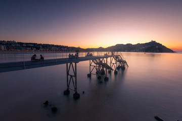 Fototapeta na wymiar Sunset at La Concha (Kontxa) bay at Donostia-San Sebastian, Basque Country. 
