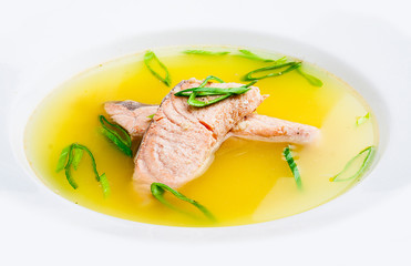 Fish soup with salmon. On white background. Meals for children.