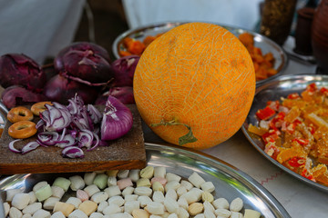 Still-life of a yellow melon and sweets
