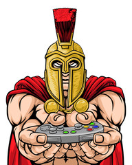 A Spartan or Trojan warrior or gladiator gamer mascot with video games controller 