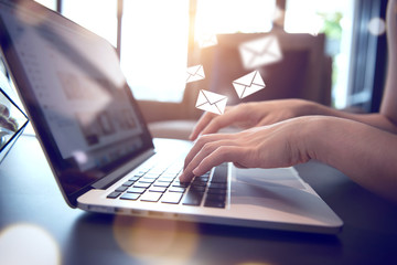Closeup Woman hand using Laptop pc with email icon, Email concept.    