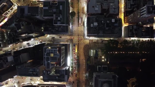 Aerial drone shot of Hong Kong at night, top down view. night streets.