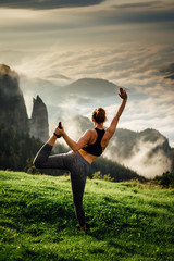 Fototapeta na wymiar young yoga woman in the mountain