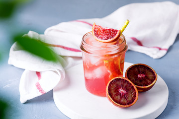 Glass Jar of Summer Juice Non-alcoholic Refreshing hHealthy Cocktail or Drink from Freshly Squeezed Red Sicilian Orange Healthy Infused Detox Drink Horizontal