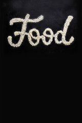 Food lettering rice on a black background poster.