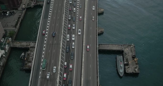 Aerial view of road in Hong Kong city, financial and business district, China, Asia. Moving cars.