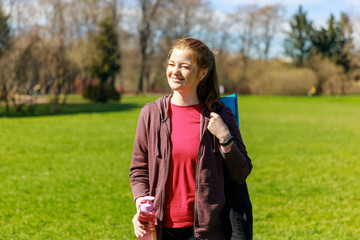 Beautiful woman after workout: tired but happy about progress. Water hydration balance