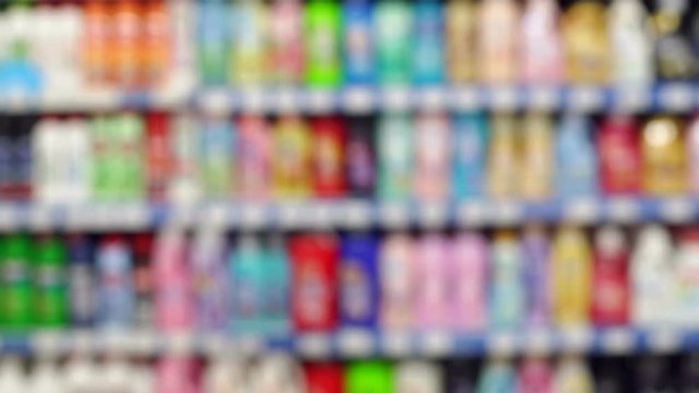 Abstract blur and bokeh supermarket and discount store interior for background. Abstract blurred supermarket with dairy product on shelves.