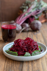 Beetroot salad with beet juise and bunch of fresh beetroot
