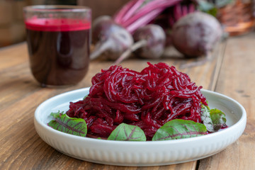 Beetroot salad with beet juise and bunch of fresh beetroot
