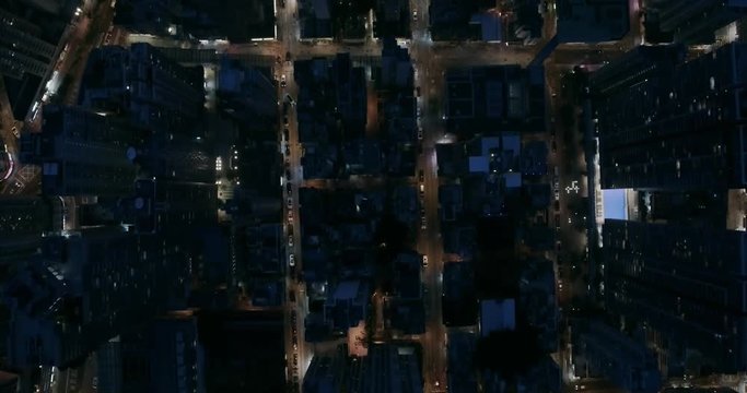 Drone aerial shot following streets of Hong Kong Kowloon side with modern skyscraper high-rises . Hong Kong is a centre of finance business in China.