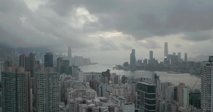 Drone aerial shot of modern skyscrapers in Hong Kong Island. Hong Kong is a popular tourist travel destination in Asia. China. Harbour view with moving boats. Inspire 2 X7.