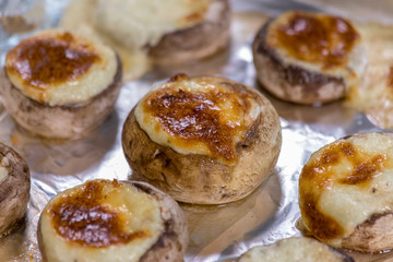 Staffed mashrooms baked in the oven on a foil