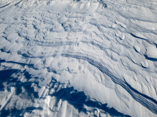 Patterns in the snow after a blizzard. Snow after a blizzard. Snow drift.