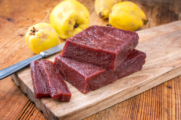 Traditional Spanish dulce de membrillo as fruit bread with quince as closeup on a wooden table