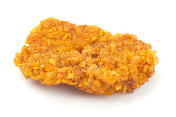 Delicious crispy chicken fillet in bread crumbs, close-up, isolated on white background