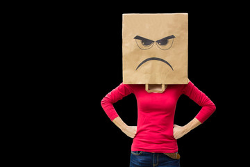 Angry woman carries paper bag  on black background