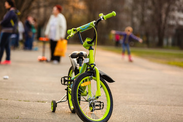 Fototapeta premium A bicycle with sunlight and green tree in park outdoor for background