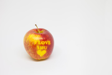 red apple on a white background with an inscription I love you