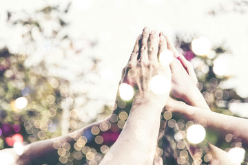 People hand assemble as a connection meeting teamwork concept. Group of people assembly hands as a business or work achievement. Man and women touch each other hands outdoor. Teamwork conceptual.
