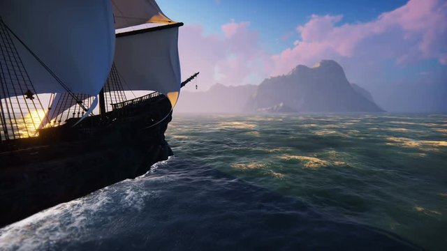 A large medieval ship at sea at dawn. An ancient medieval ship sails to a deserted rocky island.