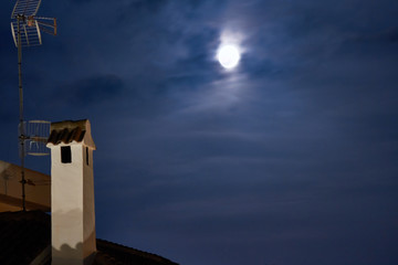 Vintage town at night. Bright moon
