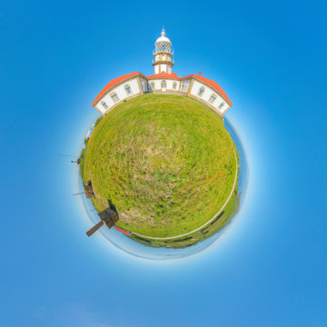 mini planet of a lighthouse on an island