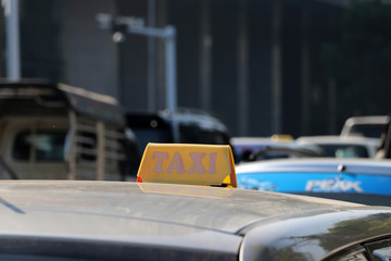 Taxi light sign or cab sign in yellow color on the car roof.