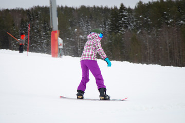 snowboarder jumping on mountain slope
