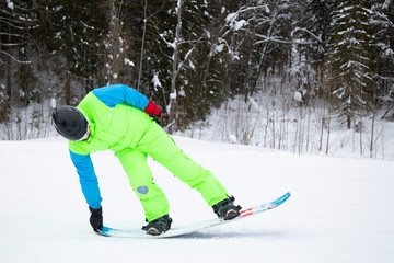 snowboarder jumping on mountain slope