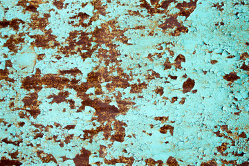 Rusty metal background with peeling blue paint