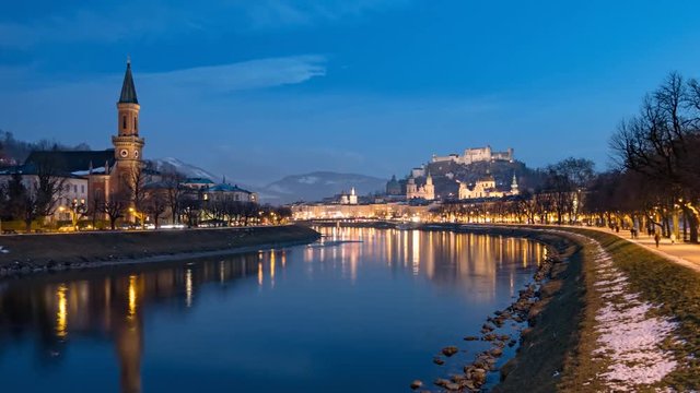 Day to night hyper lapse of Salzburg old town, Hohensalzburg Fortress, Salzburg Christuskirche and Salzach riverside, Austria.