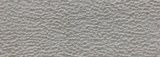 Plastered painted wall texture background, grey color, banner