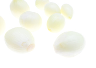 Peeled onions on a white background