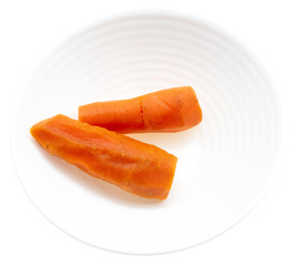 Boiled carrots in a plate on a white background