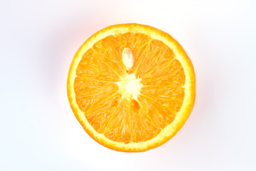 Half of juicy orange fruit. Slice of fresh delicious orange fruit on light background. Summer fruits refreshment.