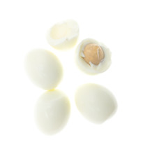 Peeled boiled eggs on a white background