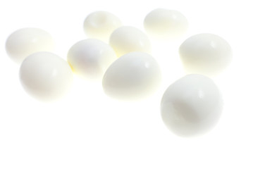 Peeled boiled eggs on a white background