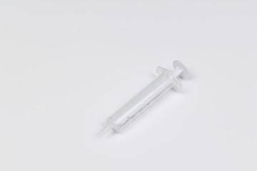 Single use syringe isolated on white
