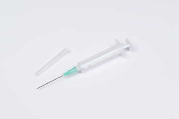 Single use syringe isolated on white