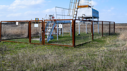 Fototapeta na wymiar Equipment of an oil well. Shutoff valves and service equipment