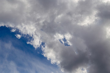 Clouds after rain before sunset as a background