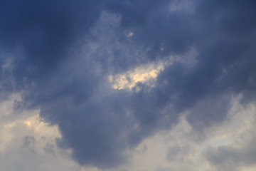 Clouds after rain before sunset as a background