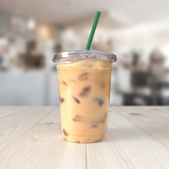 Iced coffee on wooden table