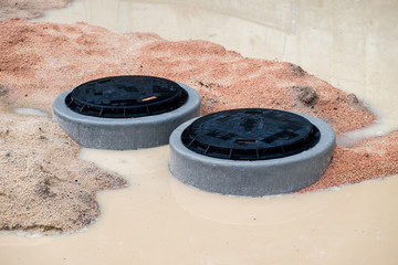 Septic tank waste system, manhole cover in public garden park,underground instalation.