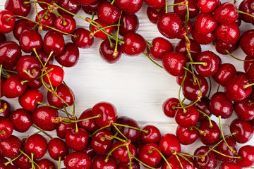 Fresh ripe cherries and copy space. Close up sweet juicy cherries with water drops and text space. Healthy fruity background.