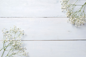 Spring background, flowers frame on blue wooden table. Banner mockup for Womans or Mothers Day,...
