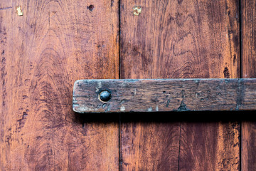 Rusty lock of old gates.Vintage door with metal handle.
