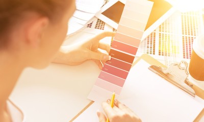 Young woman work with color panel and digital tablet